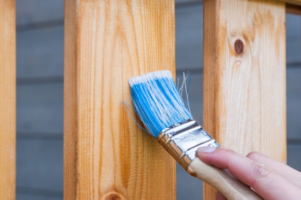 Paint brush painting on wood